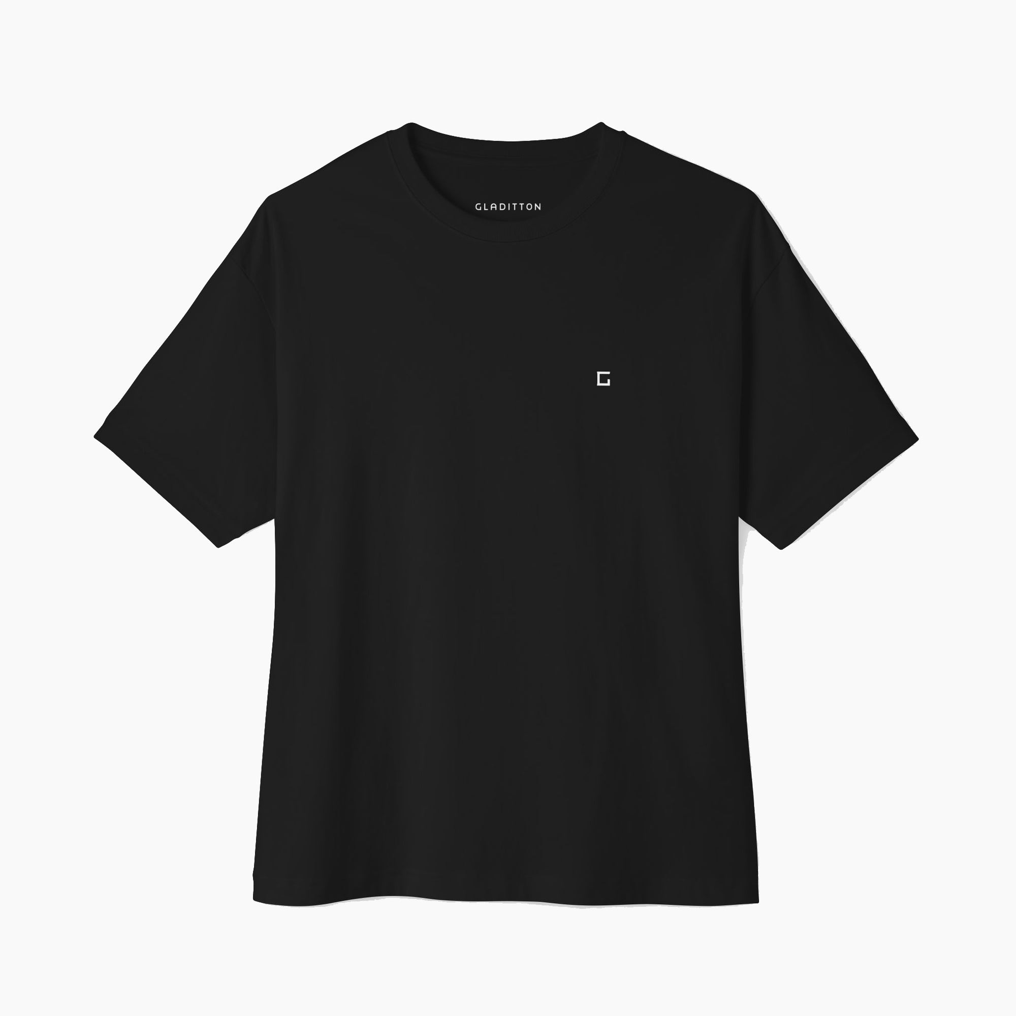 Front view of Classic Monogram T-shirt in black, featuring a minimal logo design on a relaxed fit tee.