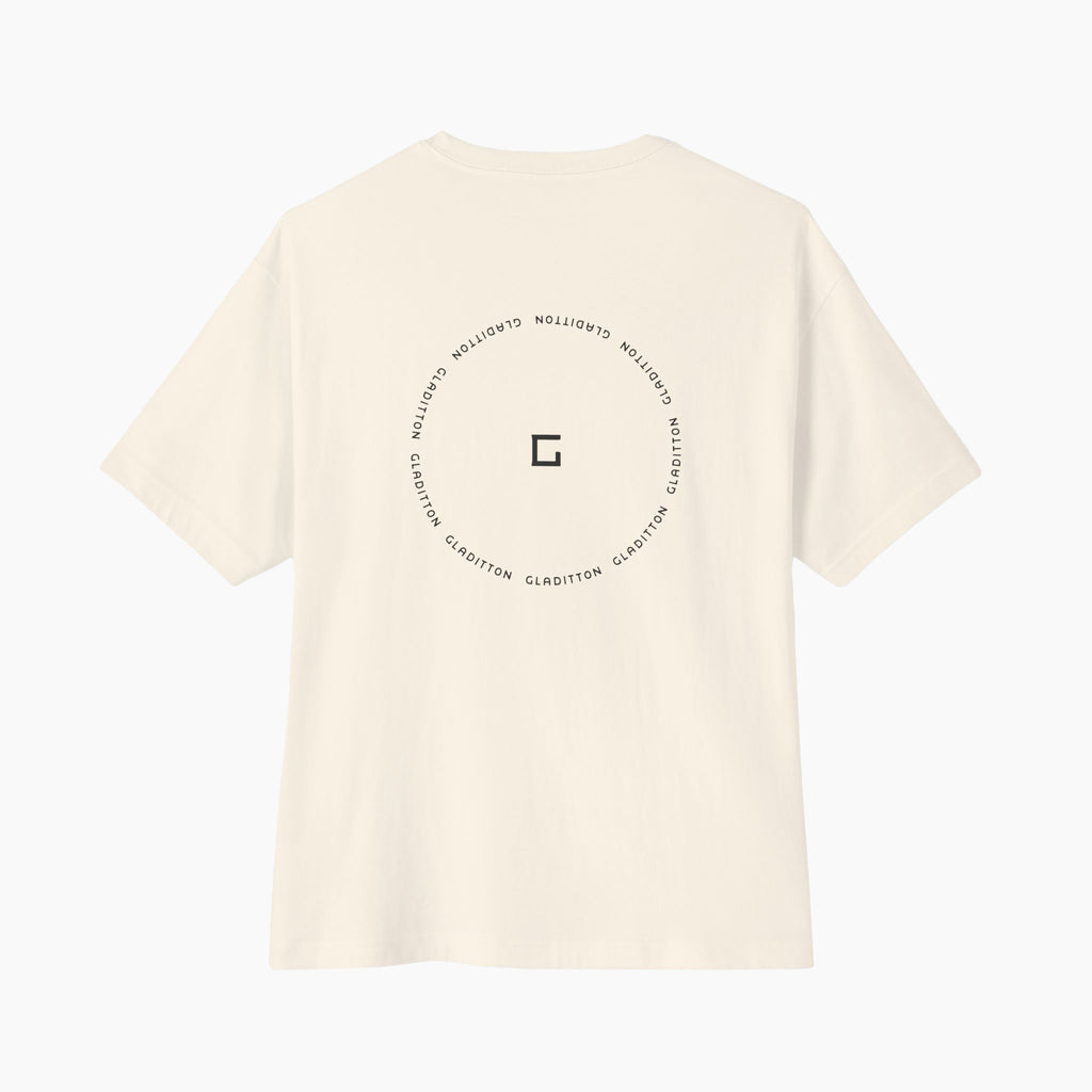 Back view of Gladitton graphic T-shirt in off-white featuring circular Gladitton logo design, modern minimalist streetwear fashion.