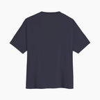 Back view of the Worthy grey men's loose fit T-shirt by Gladitton, showcasing its monogram print design.